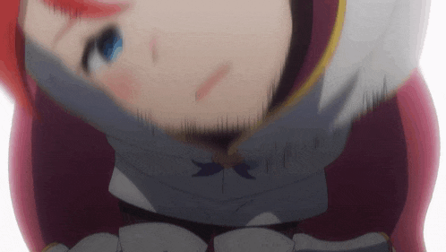 a close up of a girl with red hair and blue eyes looking down
