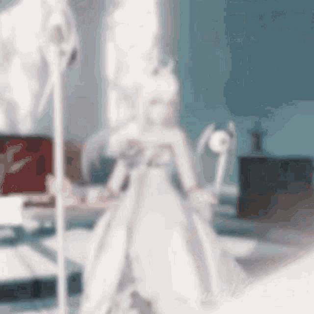 a blurred image of a doll in a white dress holding a sword .