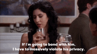 a woman is holding a glass of wine and says if i 'm going to bond with him