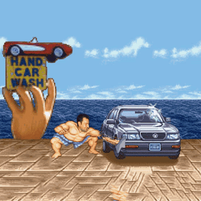 a hand holds a sign that says hand car wash