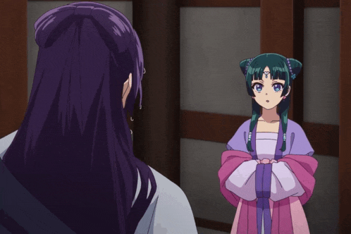 a woman with purple hair is standing next to a girl in a pink dress