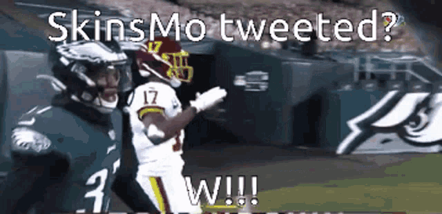 a football player with the number 17 on his jersey is being tackled by another player