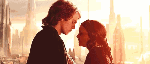 a man and a woman are looking at each other