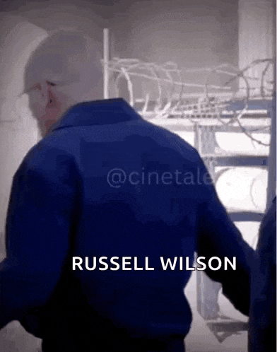 the name russell wilson is on the back of a man