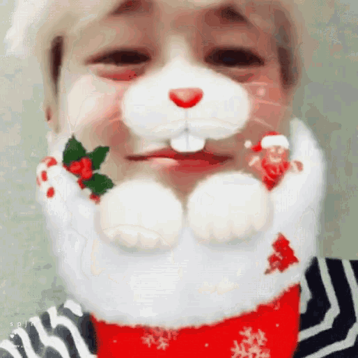 a close up of a person 's face with a christmas bunny face