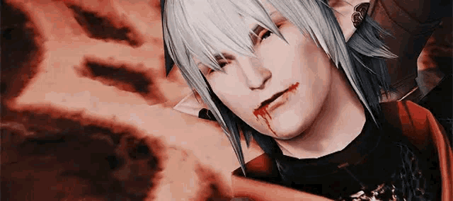 a close up of a person 's face with blood coming out of his mouth .