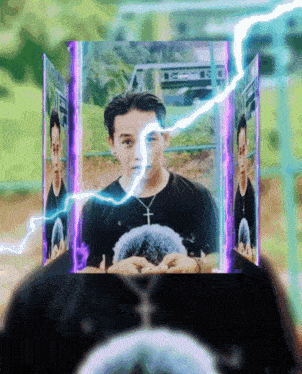 a man with a cross on his necklace is surrounded by lightning