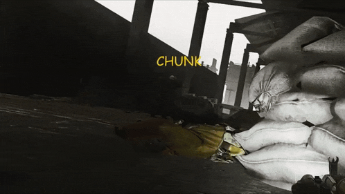 a black and white photo of a pile of bags with the word chunk in yellow