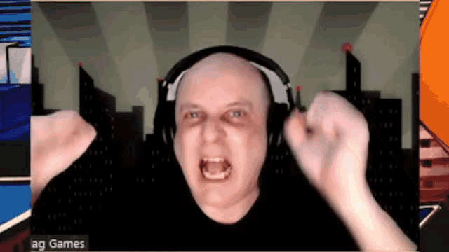 a man wearing headphones is screaming in front of a screen that says ag games on it