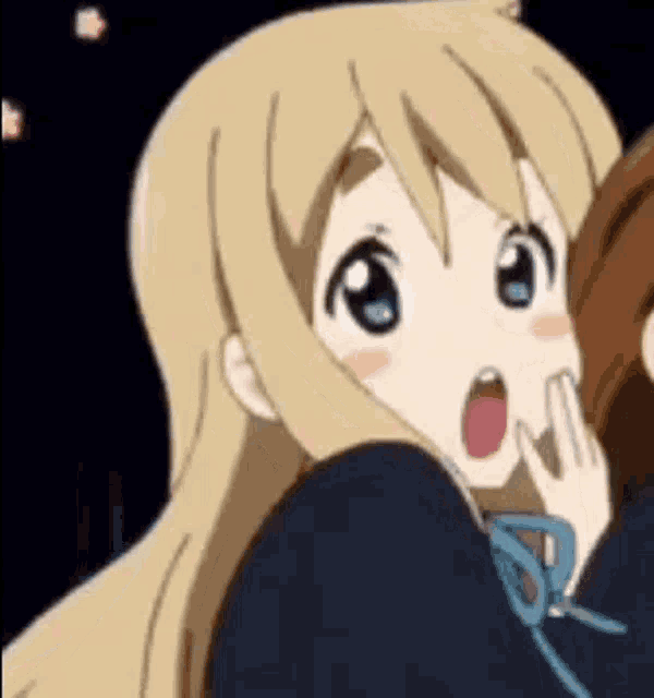 a close up of a blonde anime girl with her mouth open .