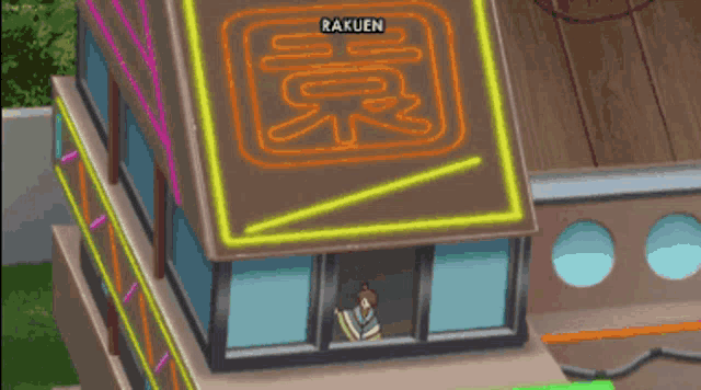 a building with a neon sign that says rakuen on top