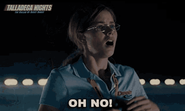 a woman wearing glasses and a blue shirt says oh no