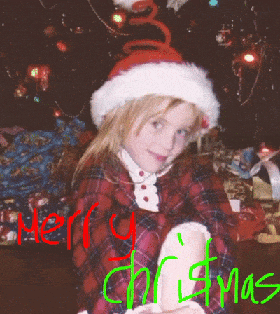 a little girl wearing a santa hat with the words merry christmas written in green