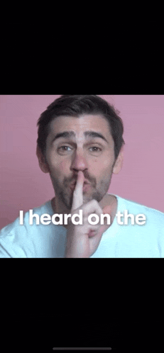 a man with his finger on his lips and the words i heard on the bottom