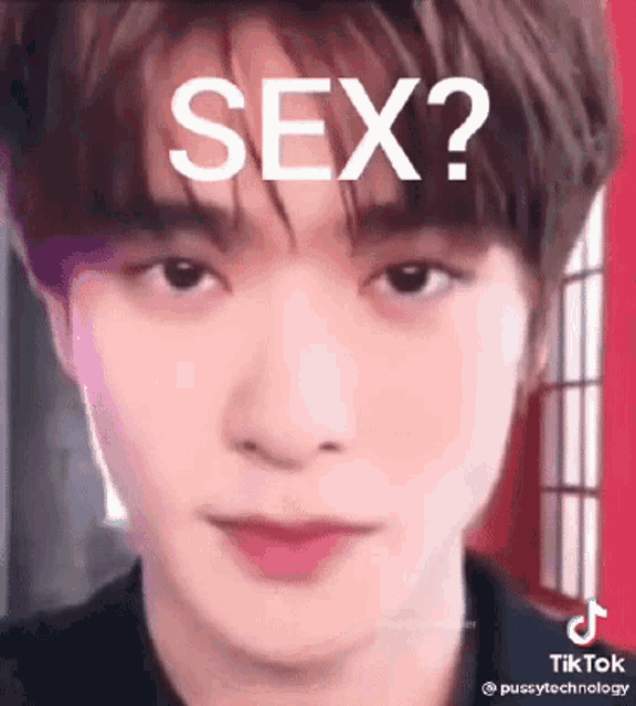 a close up of a man 's face with the words `` sex ? '' written on it .