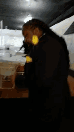 a blurry photo of a person talking on a cell phone