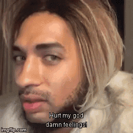 a man with long blonde hair and a beard is saying hurt my god damn feelings