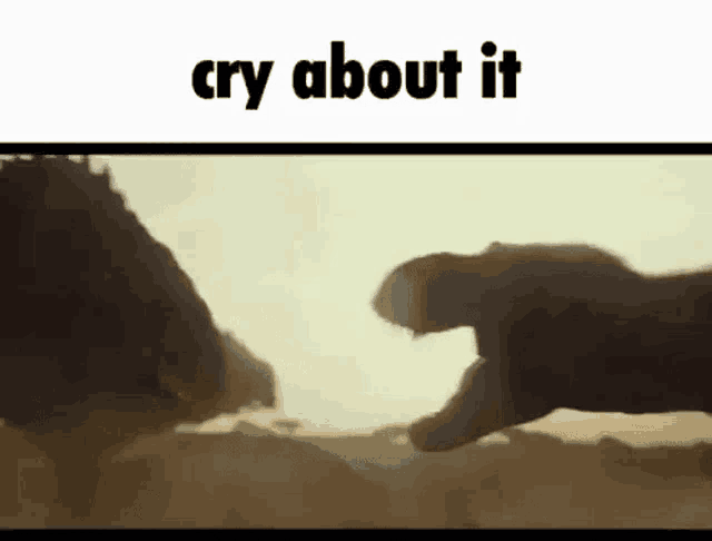 a person is crying while holding a dinosaur 's hand in the desert .
