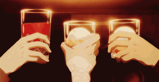 three people toasting with glasses of alcohol in a dark room