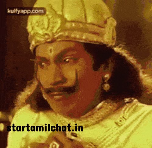 a man with a crown on his head and a mustache has the website starttamilchat.in on the bottom right