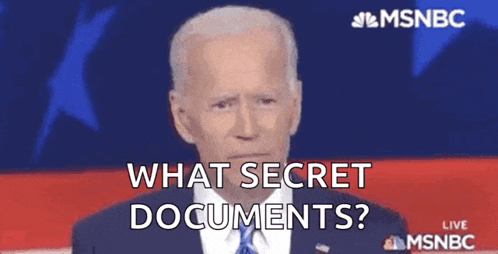 a man in a suit and tie is talking about secret documents .