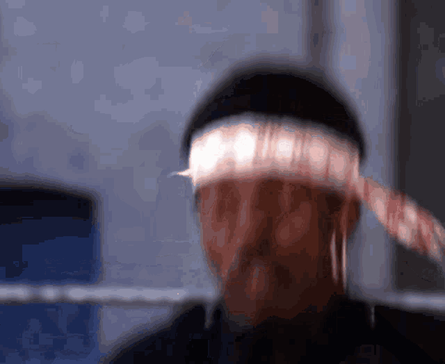 a blurry picture of a man wearing a headband