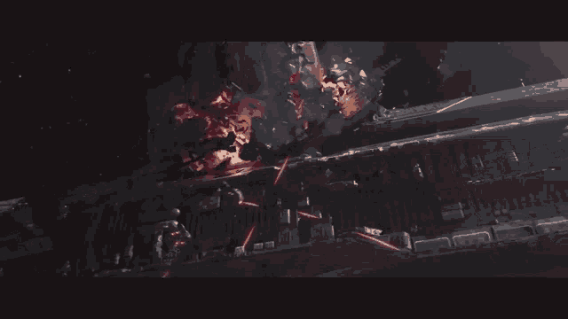 an aerial view of a building with a lot of smoke and fire