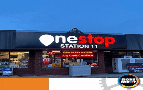 a gas station with a sign that says onestop station 11 on it