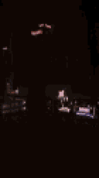 a blurry picture of a city at night with a few lights visible