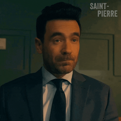 a man in a suit and tie with saint-pierre written on the bottom right