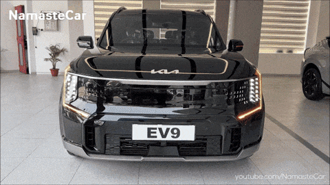 a black suv with a license plate reading ev9