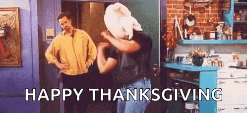 a man is dancing in a kitchen with a towel on his head and the words `` happy thanksgiving '' written below him .