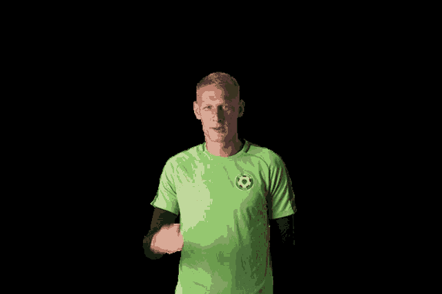 a man in a green shirt with the number 11 on the front