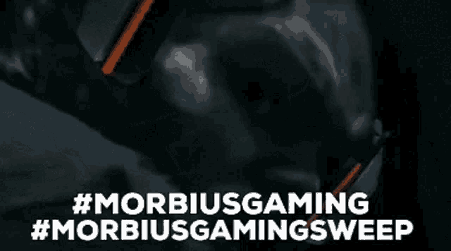 a close up of a person 's face with the words `` #morbidgaming #morbidgamingsweep '' written on it .