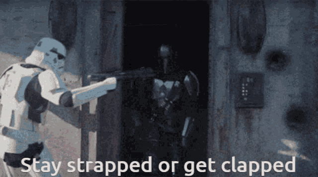 a storm trooper is standing next to another storm trooper with the words stay strapped or get clapped