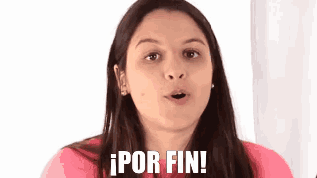 a woman in a pink shirt says " por fin " in spanish