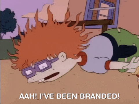 a cartoon character is laying on the ground and saying aah i 've been branded .