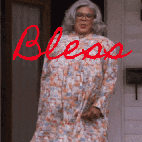 a woman in a floral dress with the word bless written in red