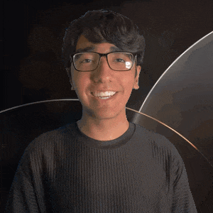 a man wearing glasses and a black shirt that says ace on it