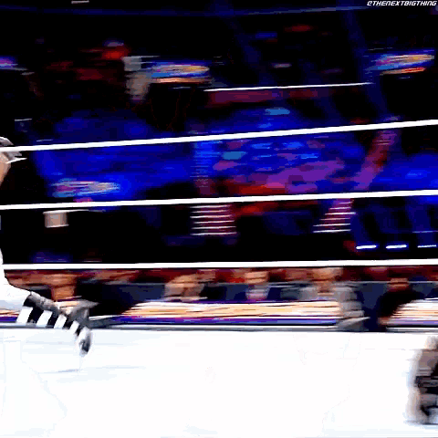a blurry picture of a person in a wrestling ring with the hashtag #thenextbig thing