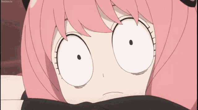 a close up of a pink anime girl 's face with a black cat ear