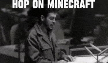 a black and white photo of a man at a podium with the words hop on minecraft above him