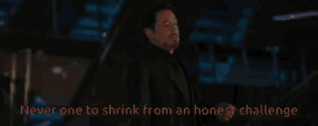 a man in a suit with the words " never one to shrink from an honest challenge " below him