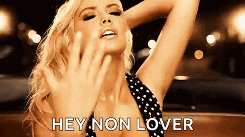 a woman in a black and white polka dot dress is saying hey non lover