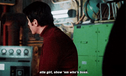 a man in a red turtleneck sweater says atta girl show 'em who 's boss