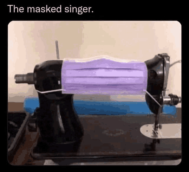 a sewing machine with a mask attached to it