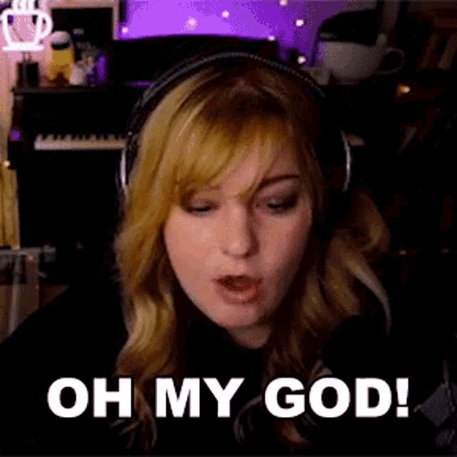 a woman wearing headphones is saying oh my god .