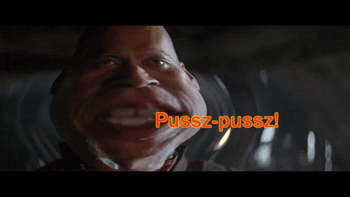 a close up of a man 's face with pussz-pussz written on the bottom