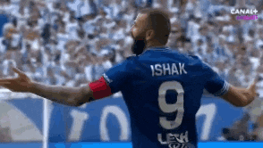 a soccer player wearing a blue jersey with the number 9 on the back