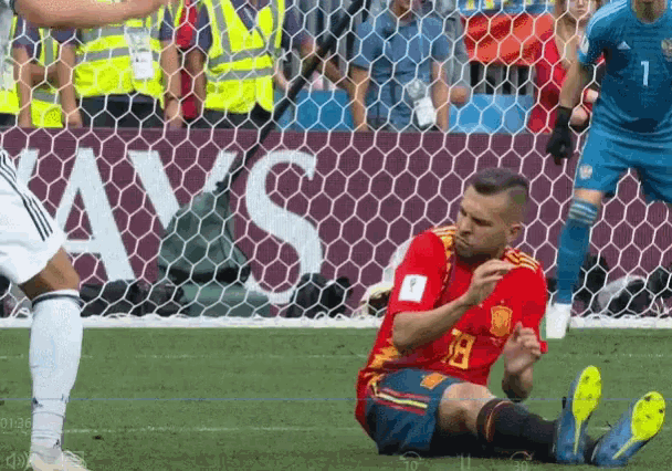 a soccer player wearing a red jersey with the number 19 on it